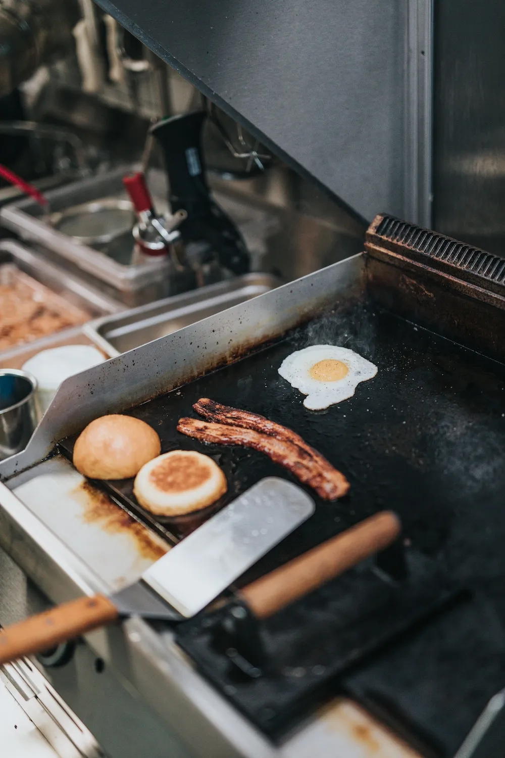 Bacon and eggs on a diner grill